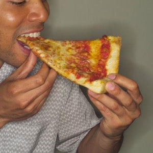 man eating pizza